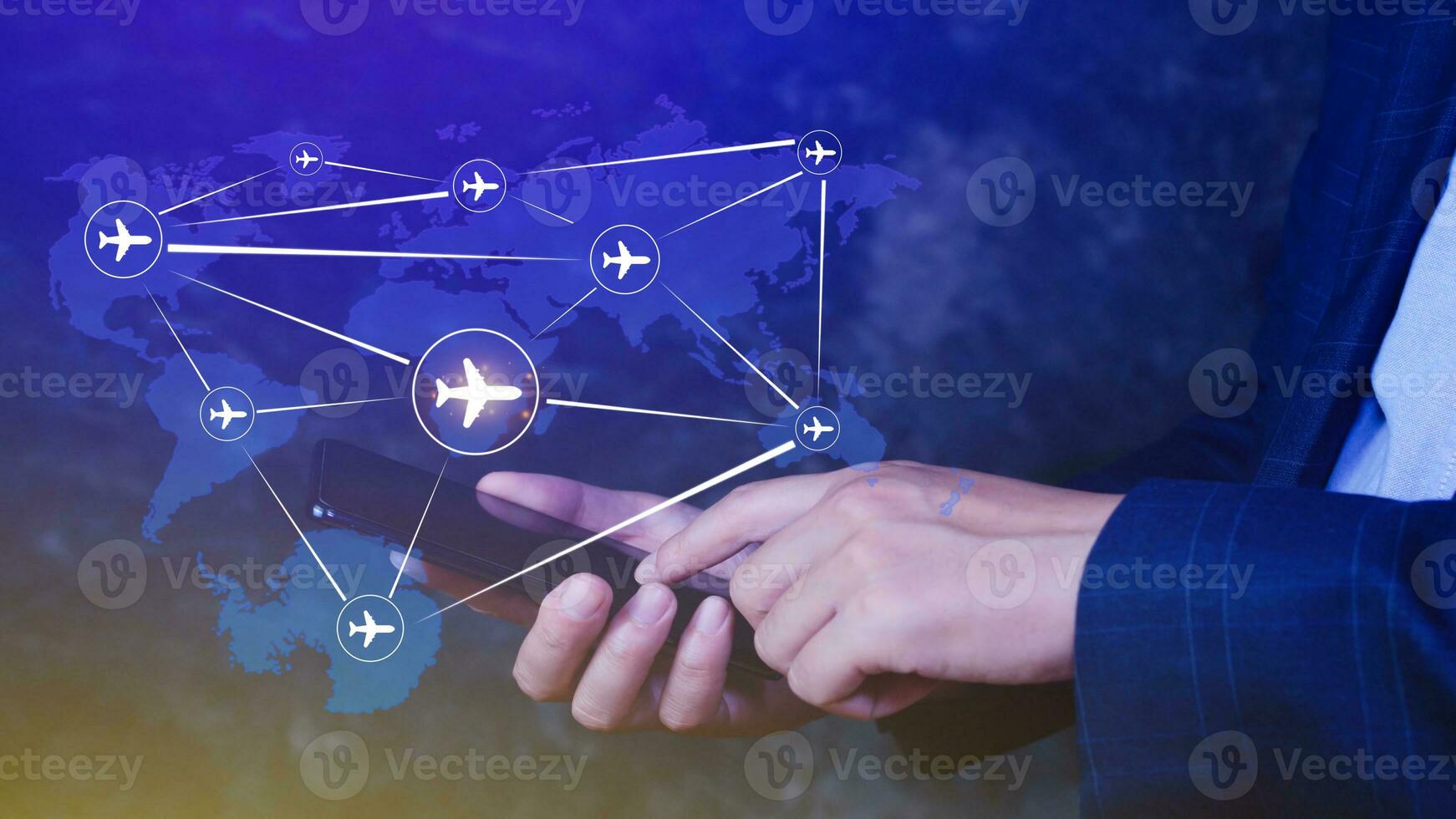 Businessman hand pushing flight booking networking with smart phone, Hand pressing light blue world map with flight routes airplane on blue background, Transportation concept. photo
