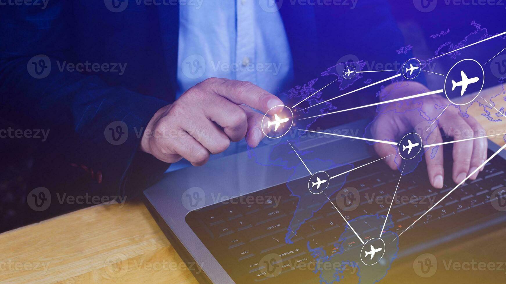 Businessman hand pushing flight booking networking, Hand pressing light blue world map with flight routes airplane, Transportation concept. photo