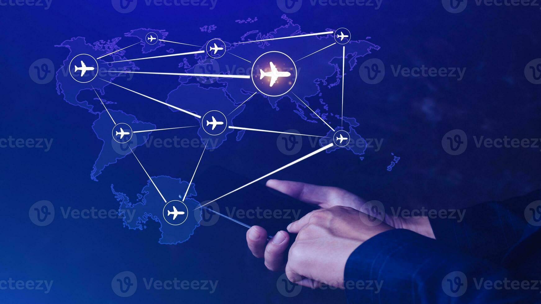 Businessman hand pushing flight booking networking with smart phone, Hand pressing light blue world map with flight routes airplane on blue background, Transportation concept. photo