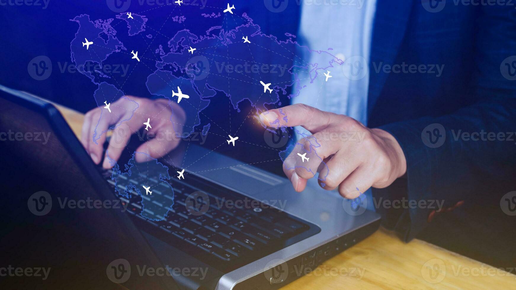 Businessman hand pushing flight booking networking, Hand pressing light blue world map with flight routes airplane, Transportation concept. photo