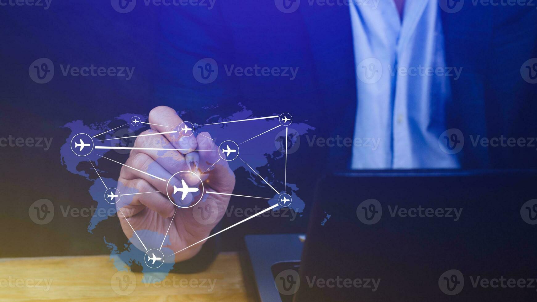 Businessman hand pushing flight booking networking, Hand pressing light blue world map with flight routes airplane, Transportation concept. photo