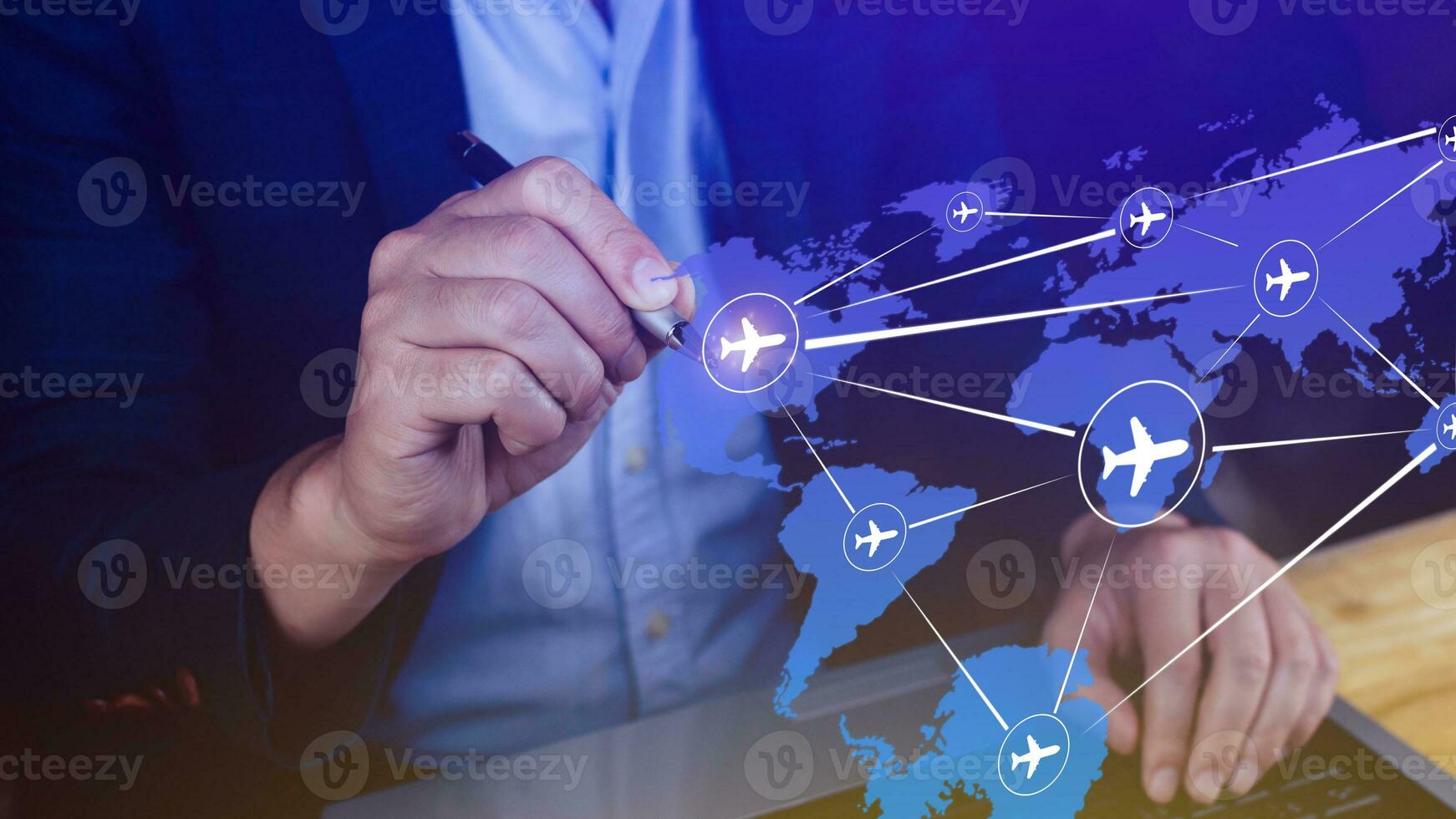 Businessman hand pushing flight booking networking, Hand pressing light blue world map with flight routes airplane, Transportation concept. photo