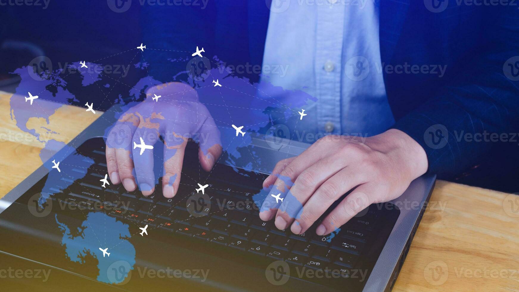 Businessman hand pushing flight booking networking, Hand pressing light blue world map with flight routes airplane, Transportation concept. photo