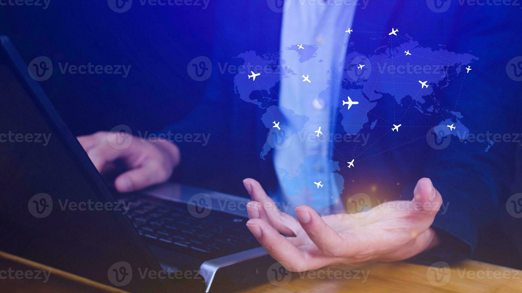 Businessman hand pushing flight booking networking, Hand pressing light blue world map with flight routes airplane, Transportation concept. photo