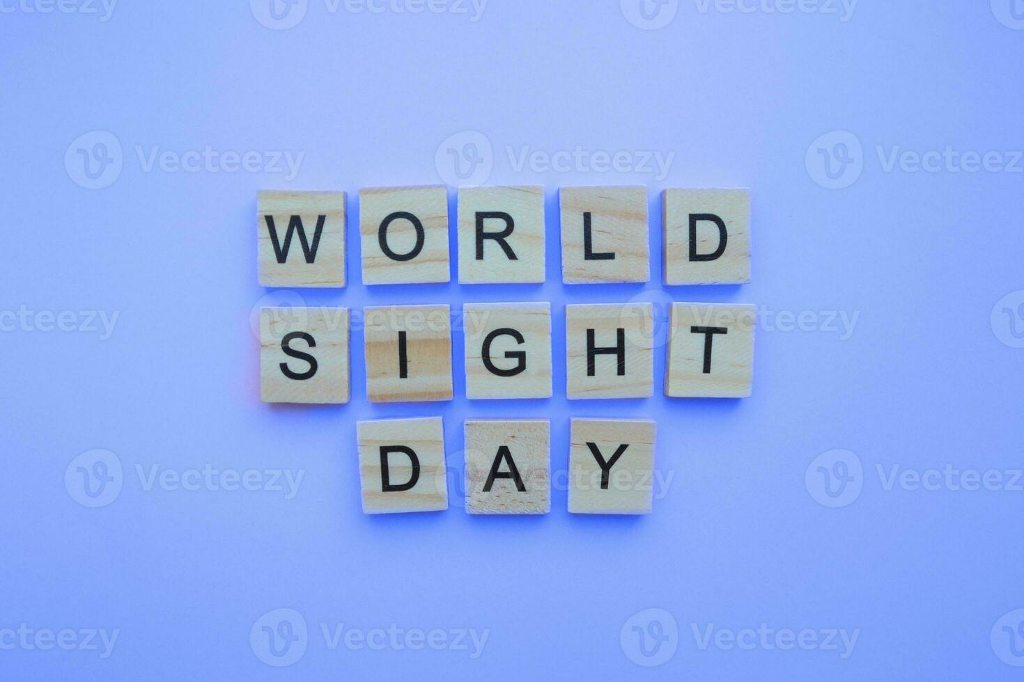 October 12, World Sight Day, minimalistic banner with the inscription in wooden letters photo