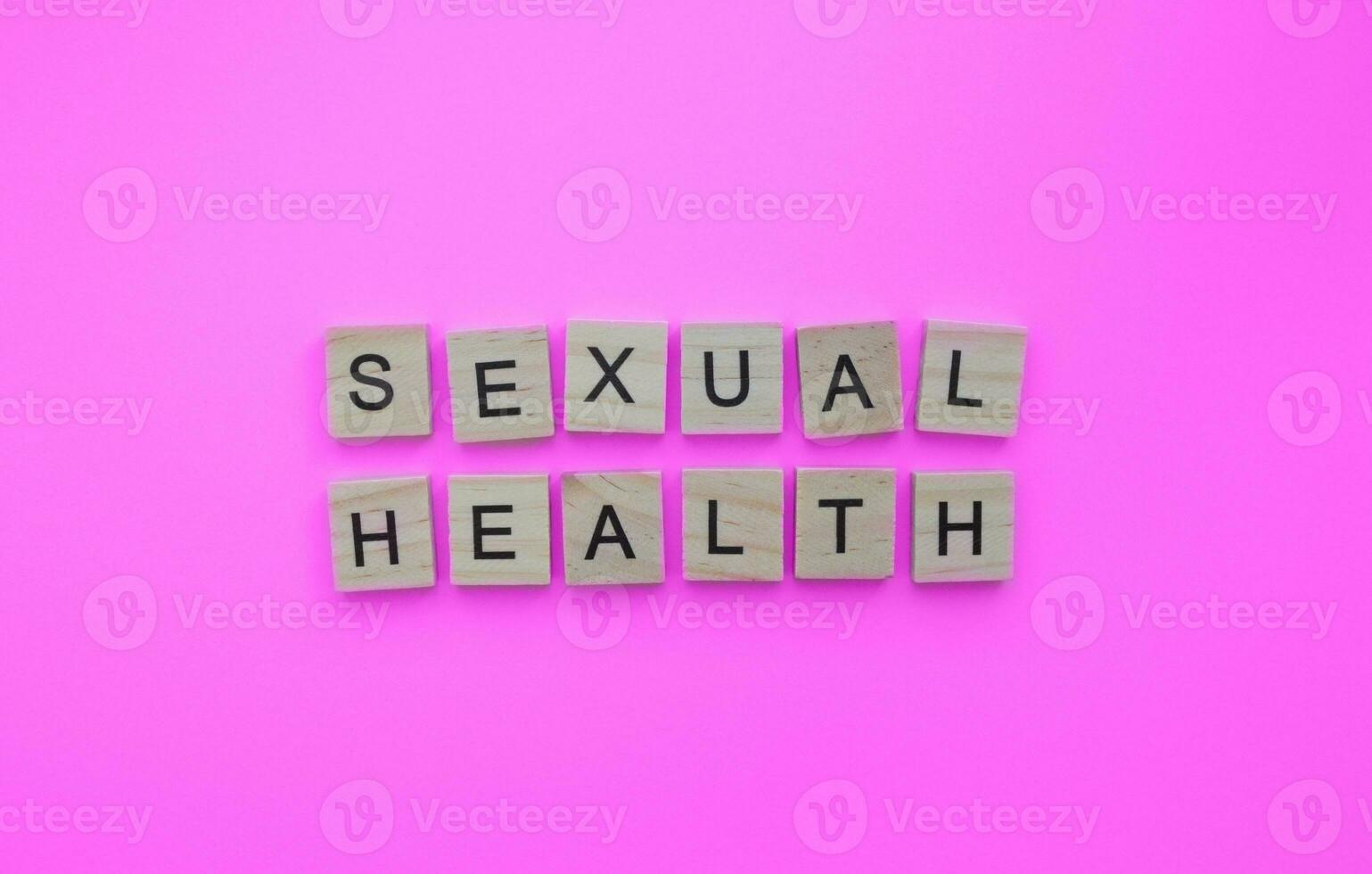 September 26, World Contraception Day, sexual health, minimalistic banner with the inscription in wooden letters photo