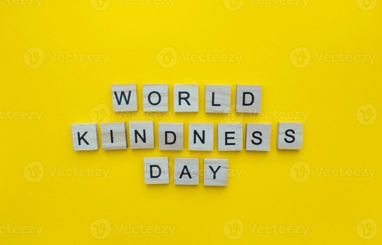 November 13, World Kindness Day, minimalistic banner with the inscription in wooden letters photo