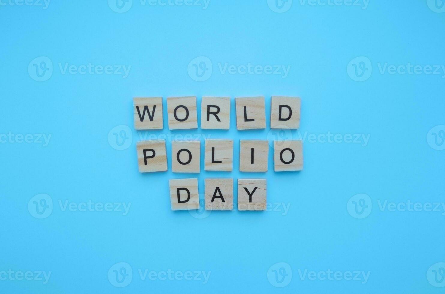 October 24, World Polio Day, minimalistic banner with the inscription in wooden letters photo