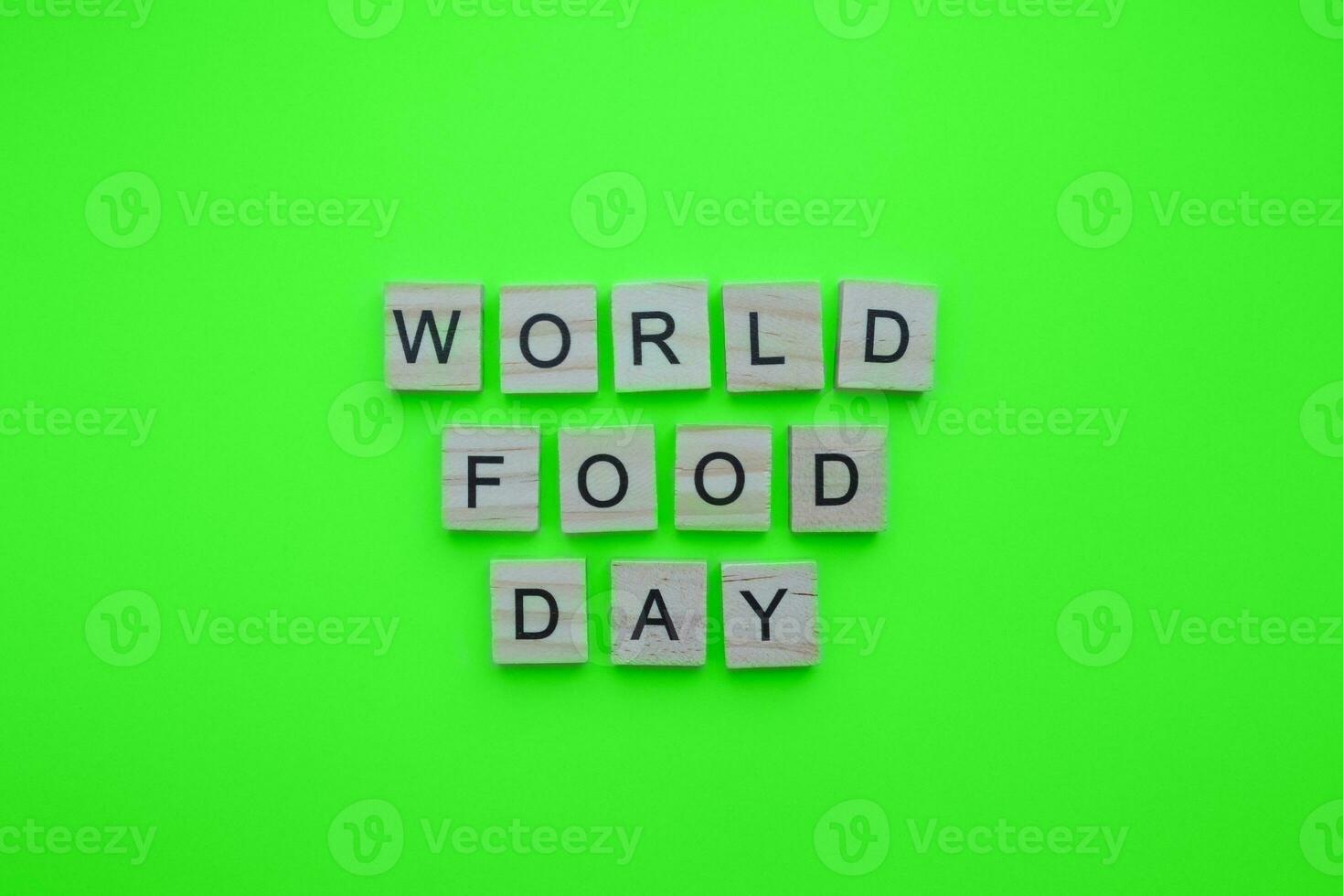 October 16, World Food Day, minimalistic banner with the inscription in wooden letters photo