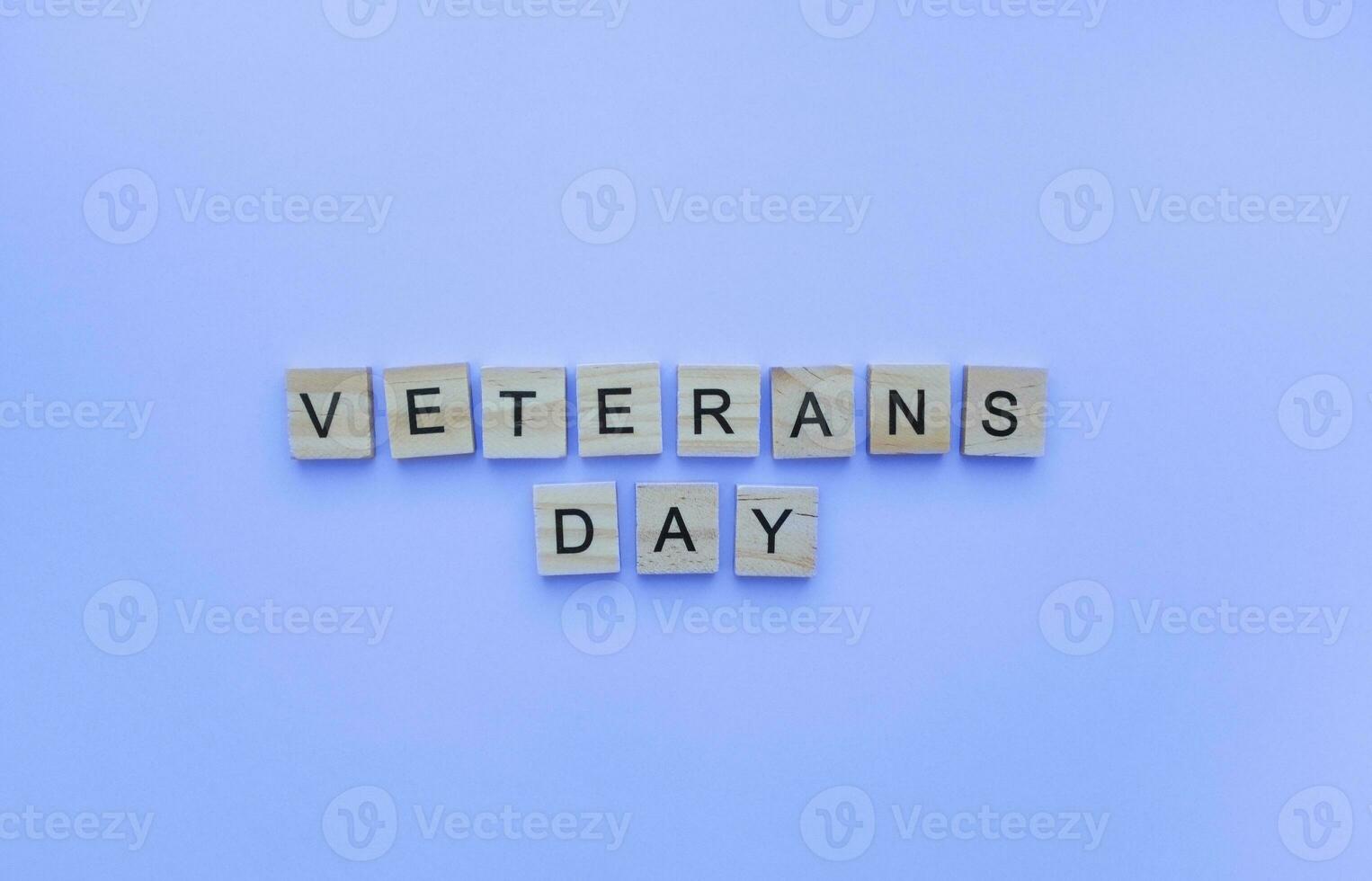 November 11, Veterans day, minimalistic banner with the inscription in wooden letters photo