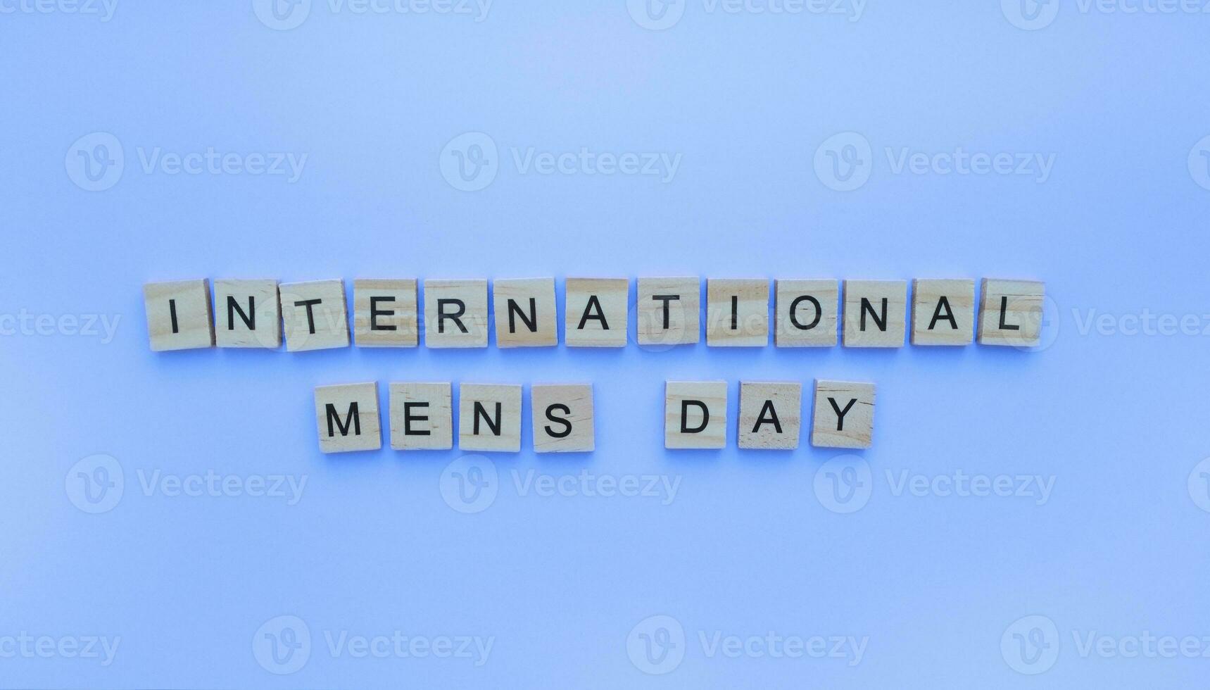 November 18, International Mens Day, IMD, minimalistic banner with the inscription in wooden letters photo