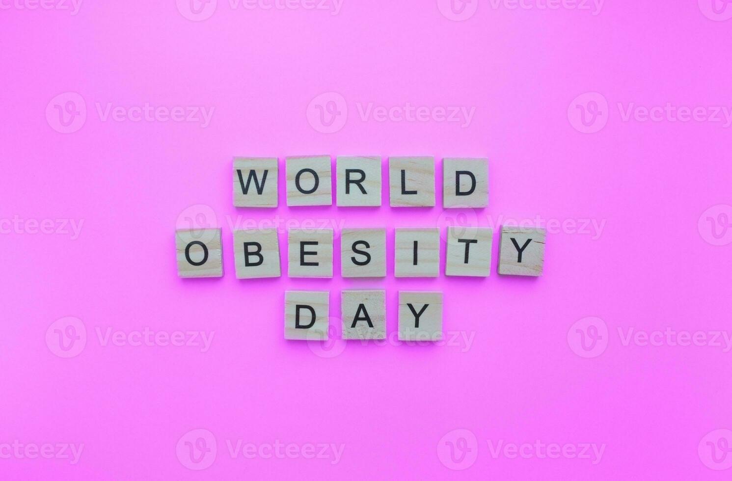 October 11, World Obesity Day, minimalistic banner with the inscription in wooden letters photo