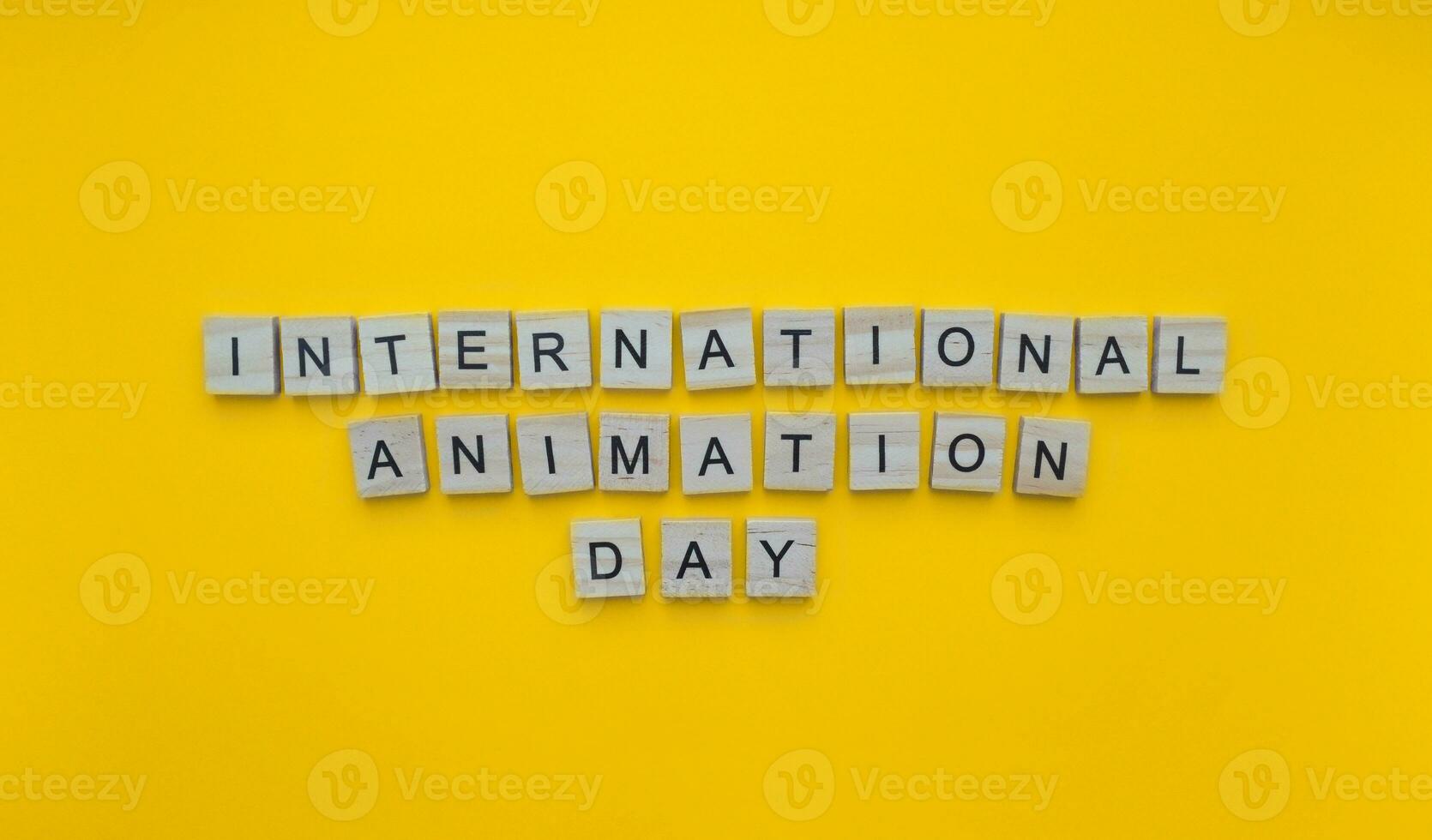 October 28, International Animation Day, minimalistic banner with the inscription in wooden letters photo