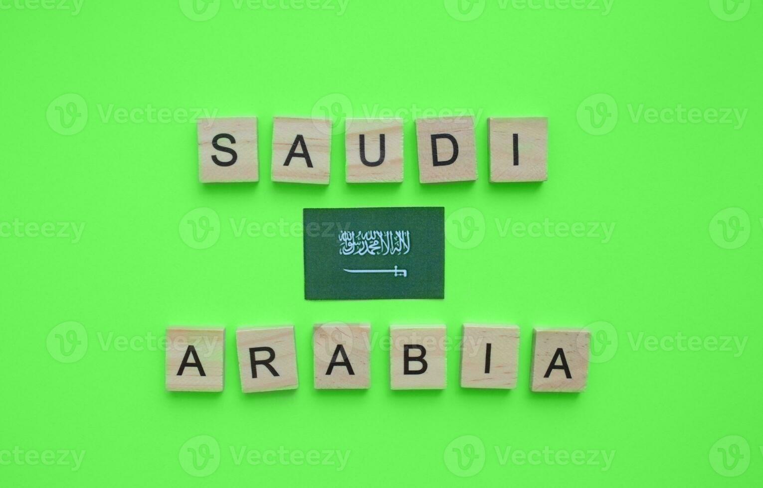 September 23, Saudi Arabia National Day, the flag of Saudi Arabia, a minimalistic banner with an inscription in wooden letters photo