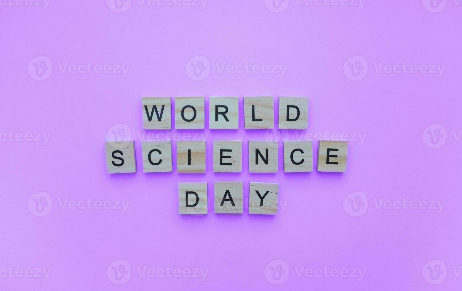 November 10, World Science Day for Peace and Development, minimalistic banner with the inscription in wooden letters photo