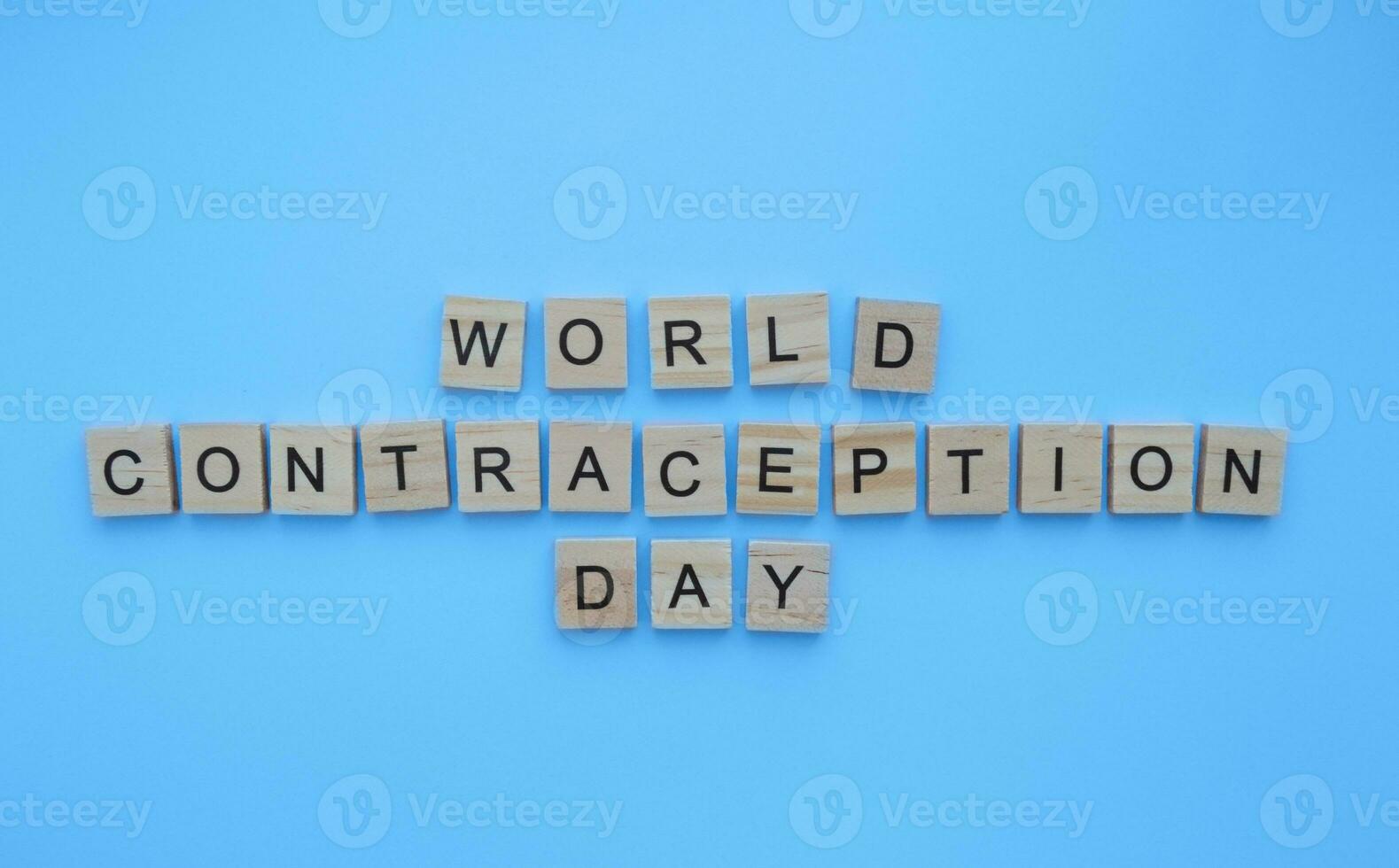 September 26, World Contraception Day, minimalistic banner with the inscription in wooden letters photo