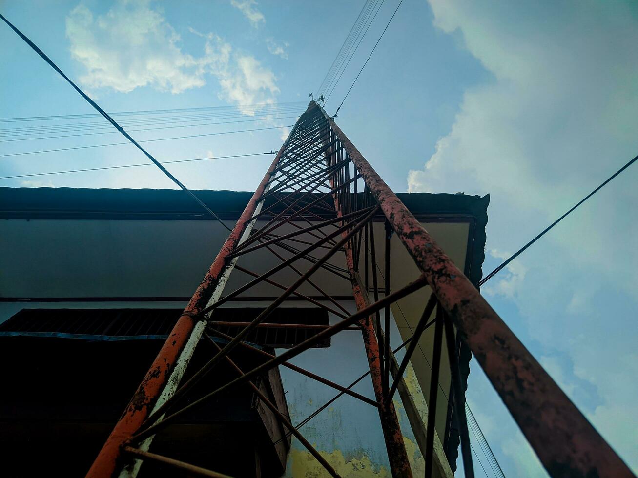 view of tower with buildings against sky background photo