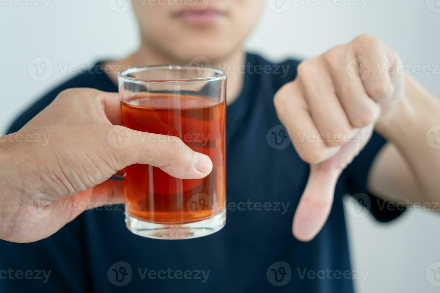 man refuses say no and avoid to drink an alcohol whiskey , stopping hand sign male, alcoholism treatment, alcohol addiction, quit booze, Stop Drinking Alcohol. Refuse Glass liquor, unhealthy, reject photo