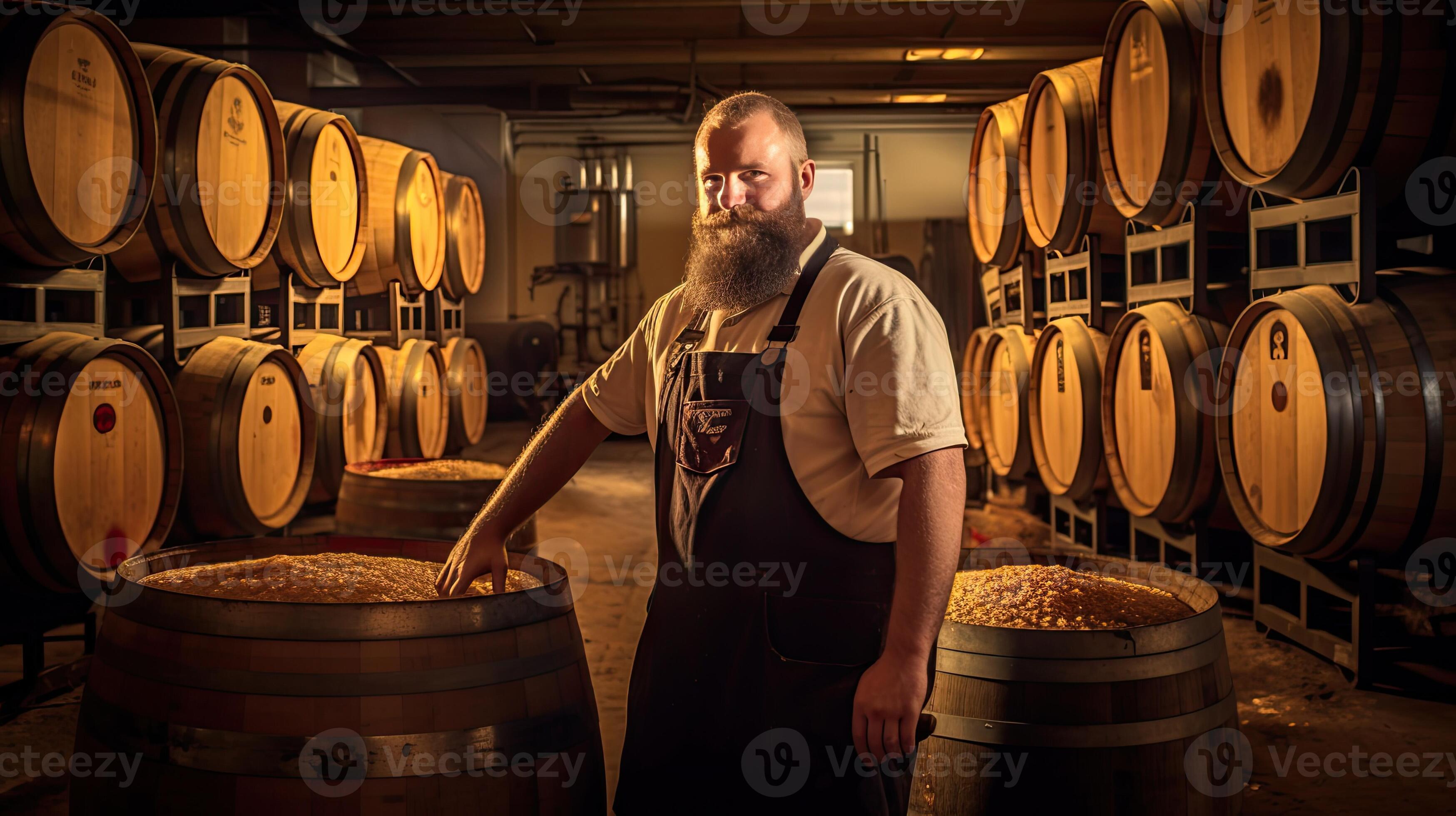 A brewer working and inspects oak barrels for fermentation in the