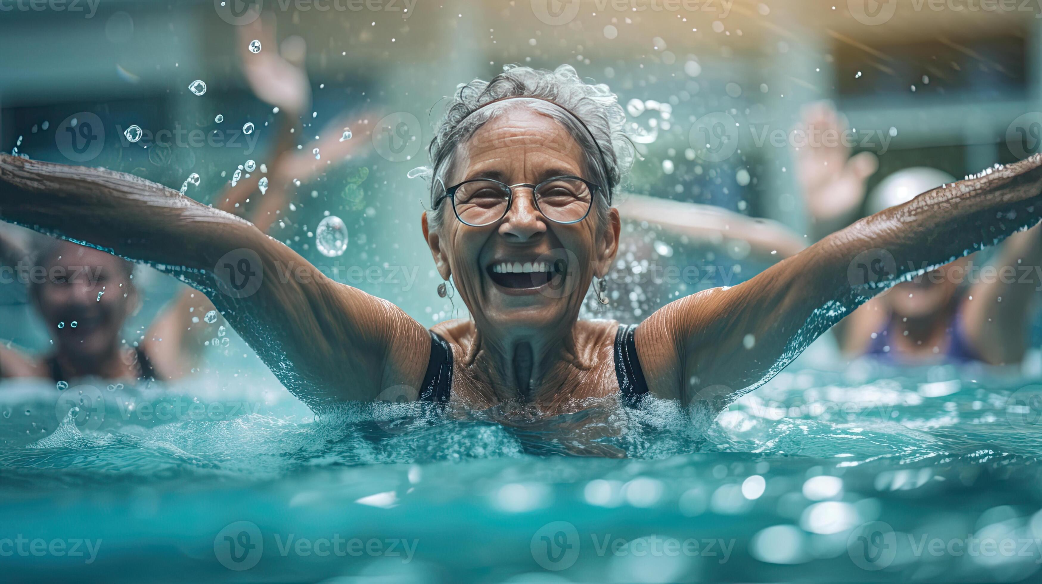 Exercise in water, Active senior women enjoying aqua fit class in a