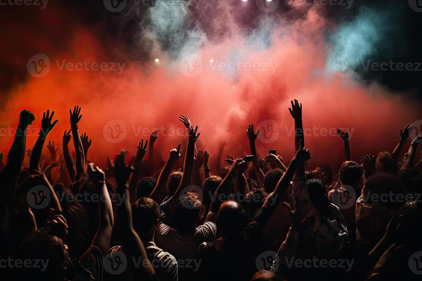 Crowd cheering at a music festival, hands raised up in the air. . photo