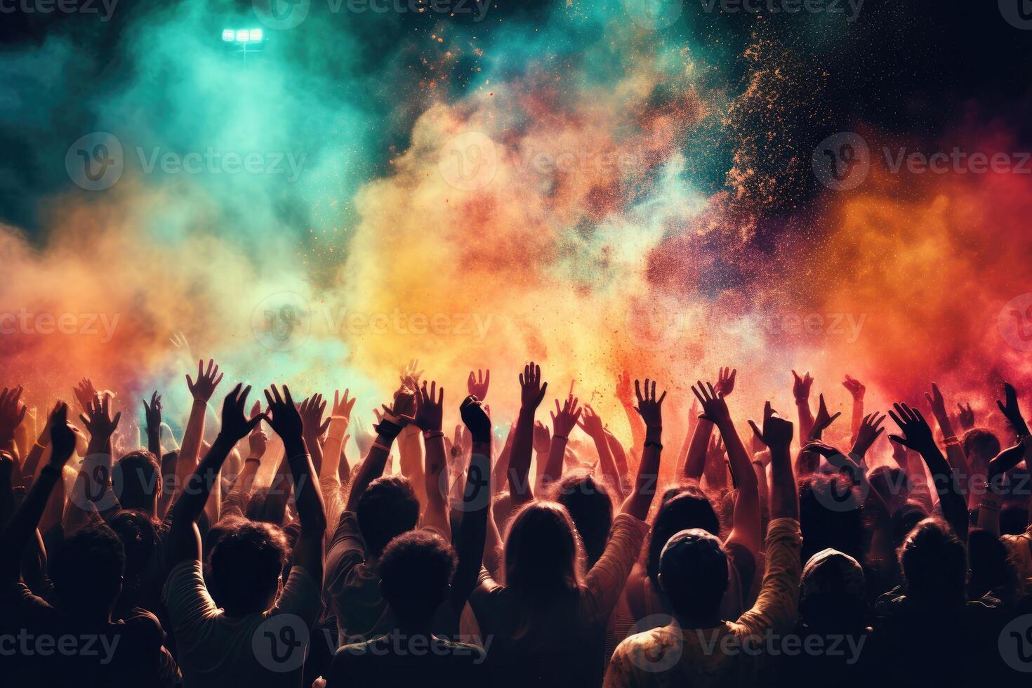 Cheering crowd at a live music concert with colored smoke and fire. . photo