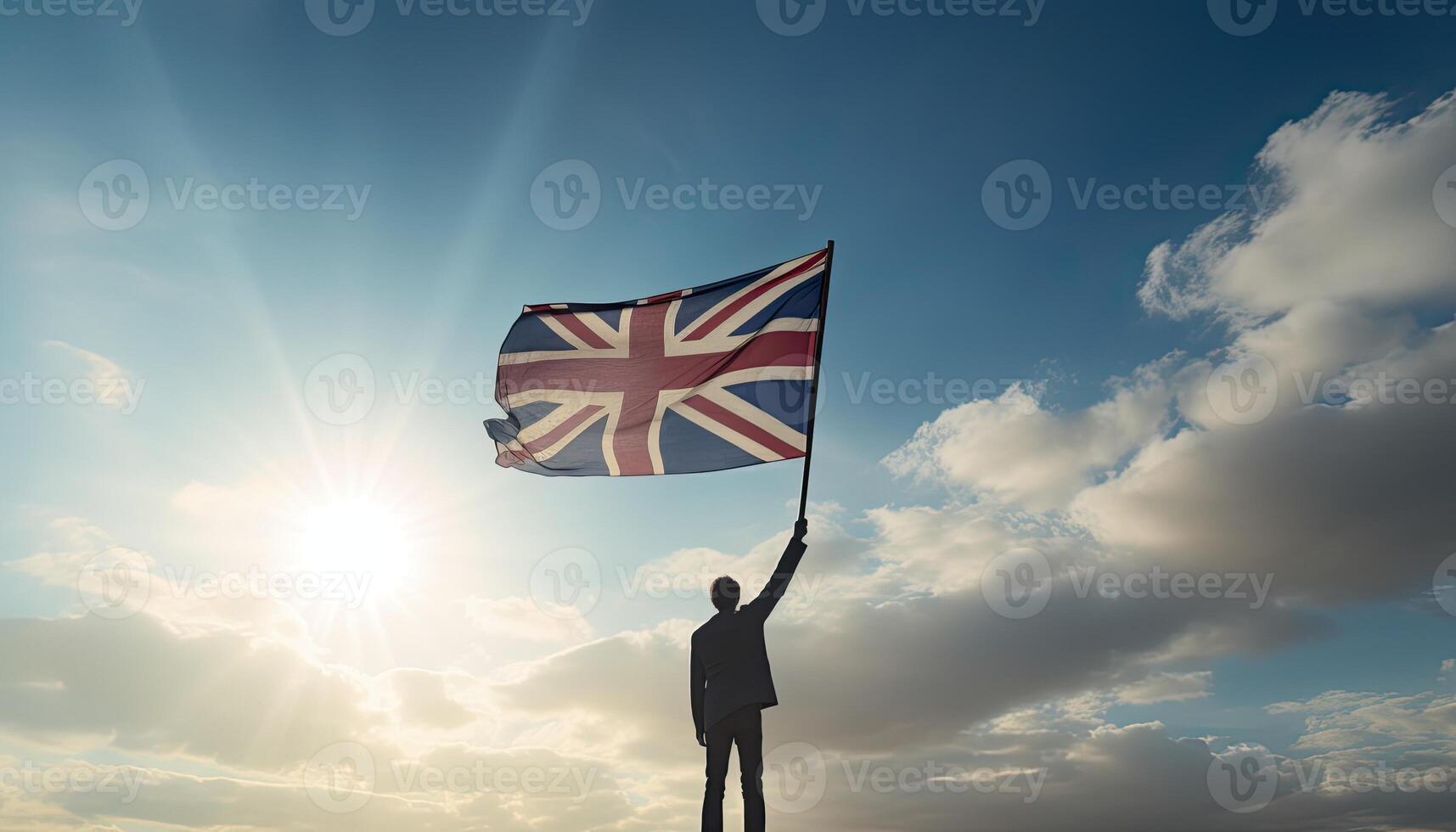 United Kingdom flag waving in the wind as a symbol of power and success. . photo