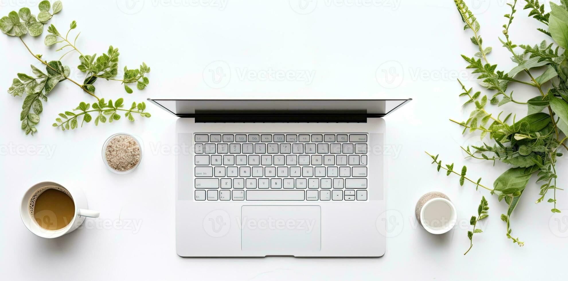 Laptop with cup of coffee and green leaves on white background, top view. AI Generated. photo