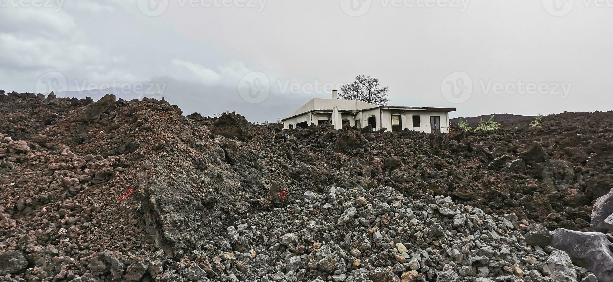 Building destroyed by the volcanic lava flow from the Cumbre Vieja volcano, on the island of La Palma photo