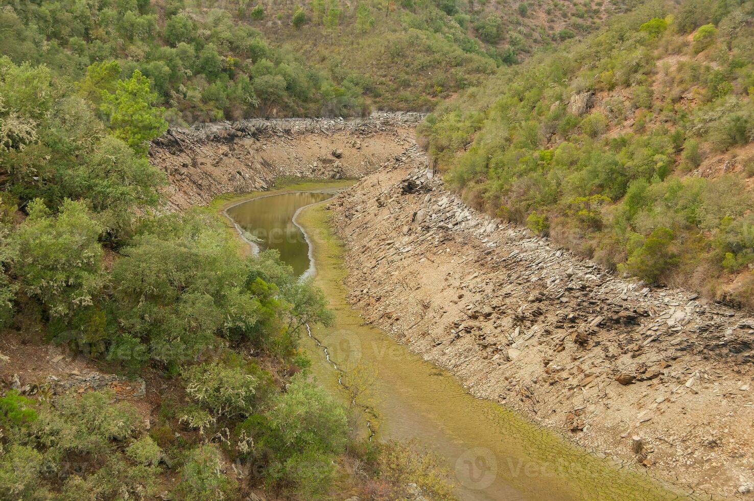 The Ponsul River is a affluent of the Tejo River, in Portugal, and is a very large river. At this time it is completely dry, without water and with its bed cracked due to climate change photo