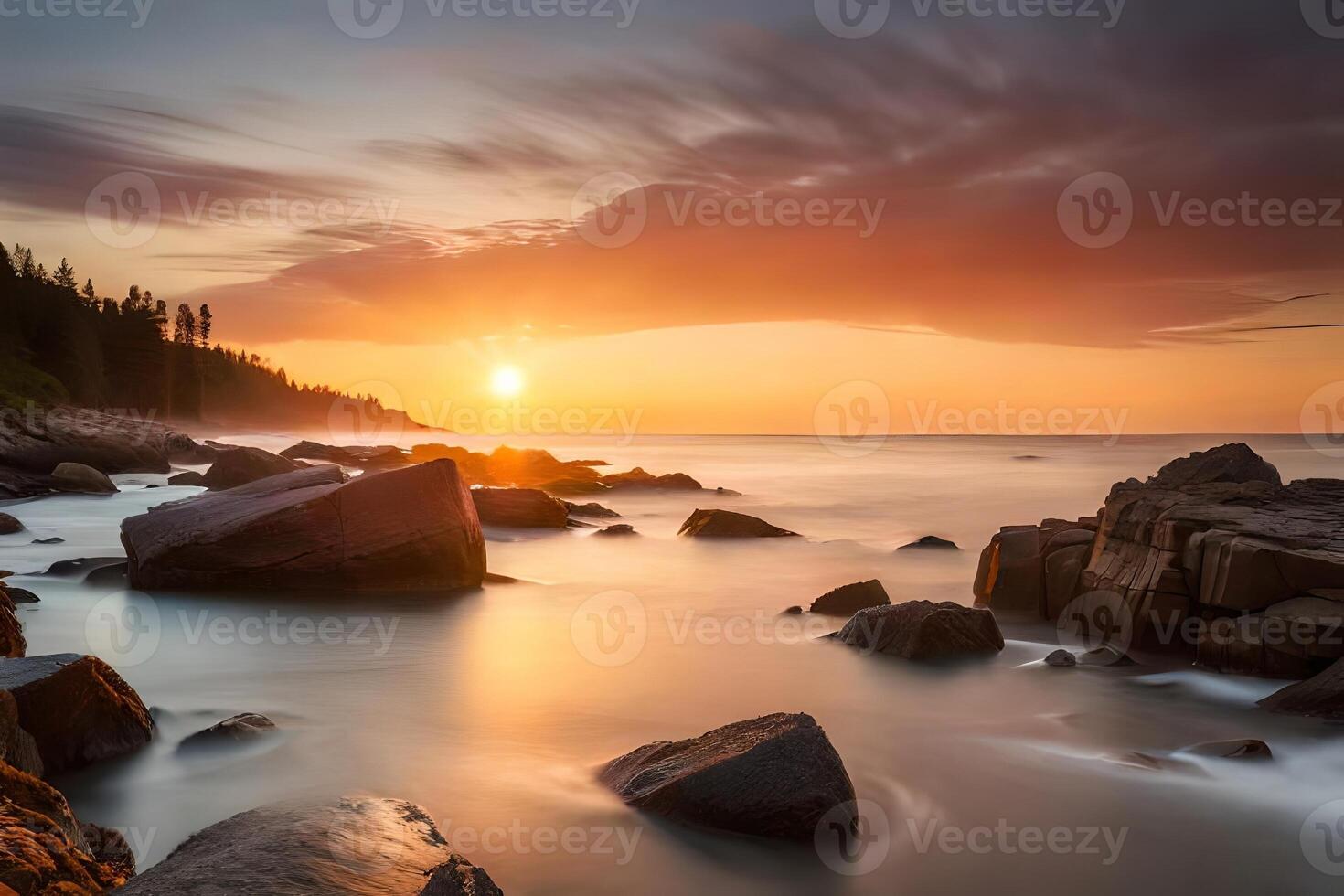 A extreme harsh coast washed in warm colors in the midst of a astonishing nightfall. photo