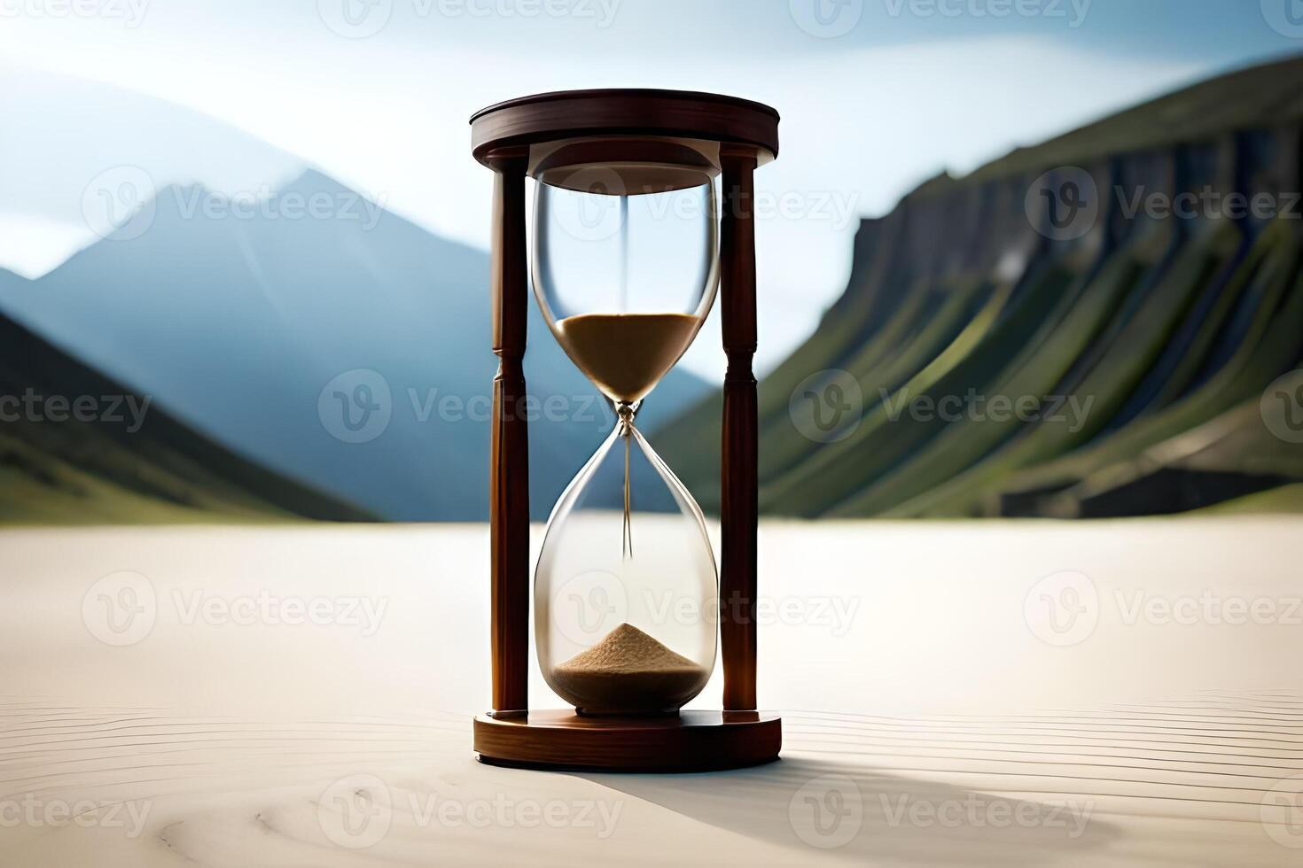 Grandstand an hourglass with the final grains of sand falling, implying the conclusion of one year and the graduation of another. photo