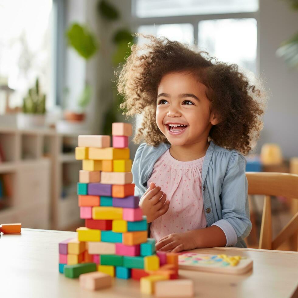 A little girl smiling while creating a rainbow tower with blocks photo