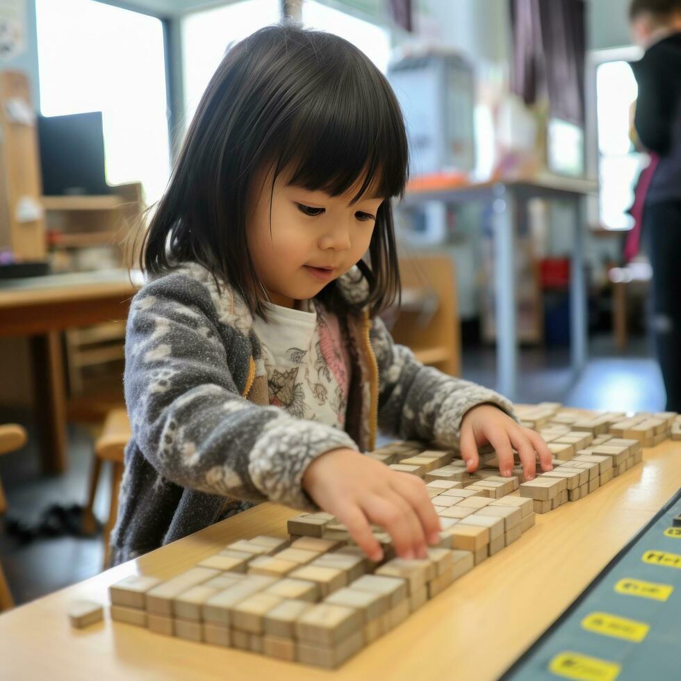 A young child using blocks to learn basic counting and math skills. photo