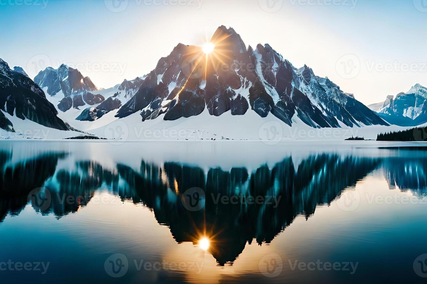 A calm lake reflecting the brilliant mountain peaks that cement it. photo