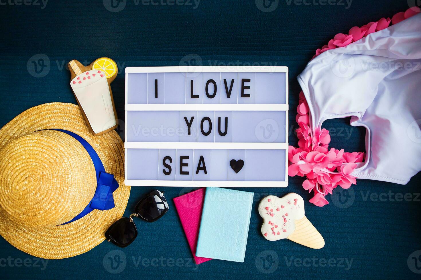 Summer layout-swimsuit, hat, sunglasses, passport, ice cream, cocktail-inscription I love the sea photo
