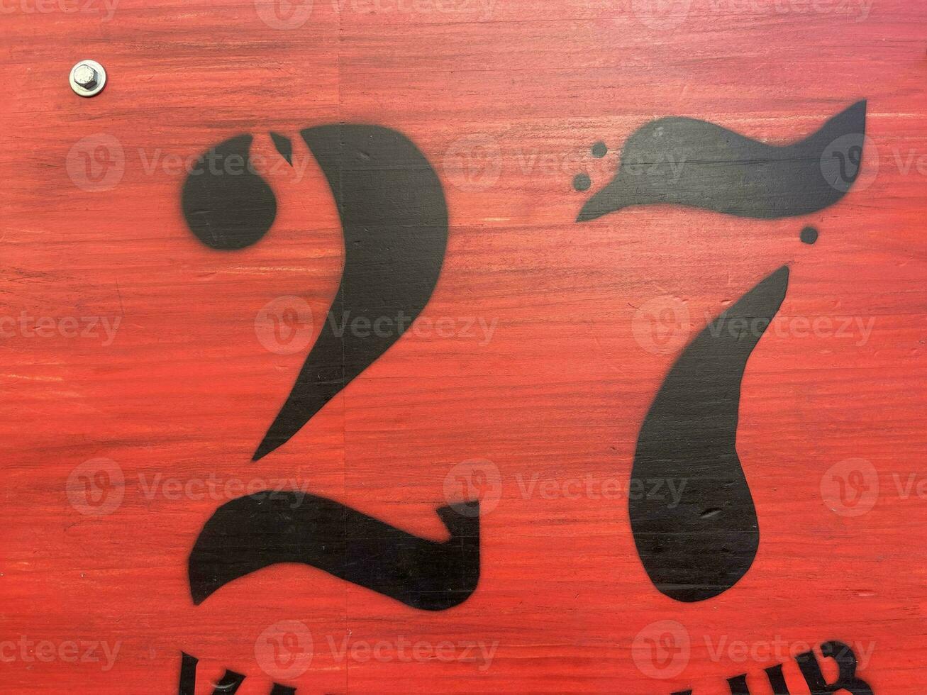 Number 27 on a red board photo