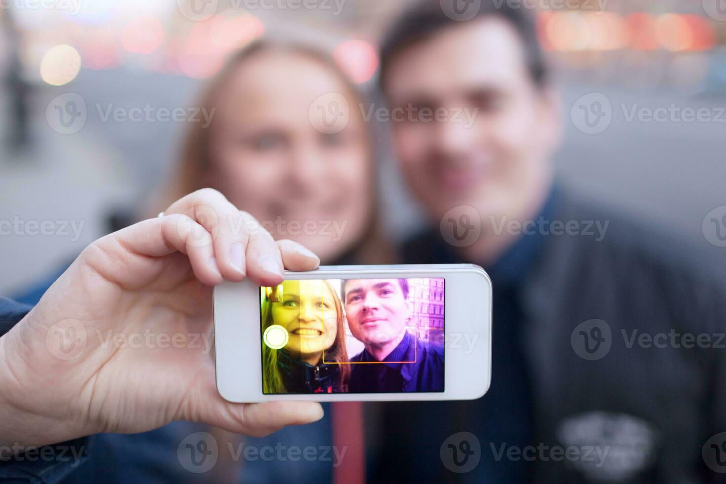 Happy couple taking self portrait photo