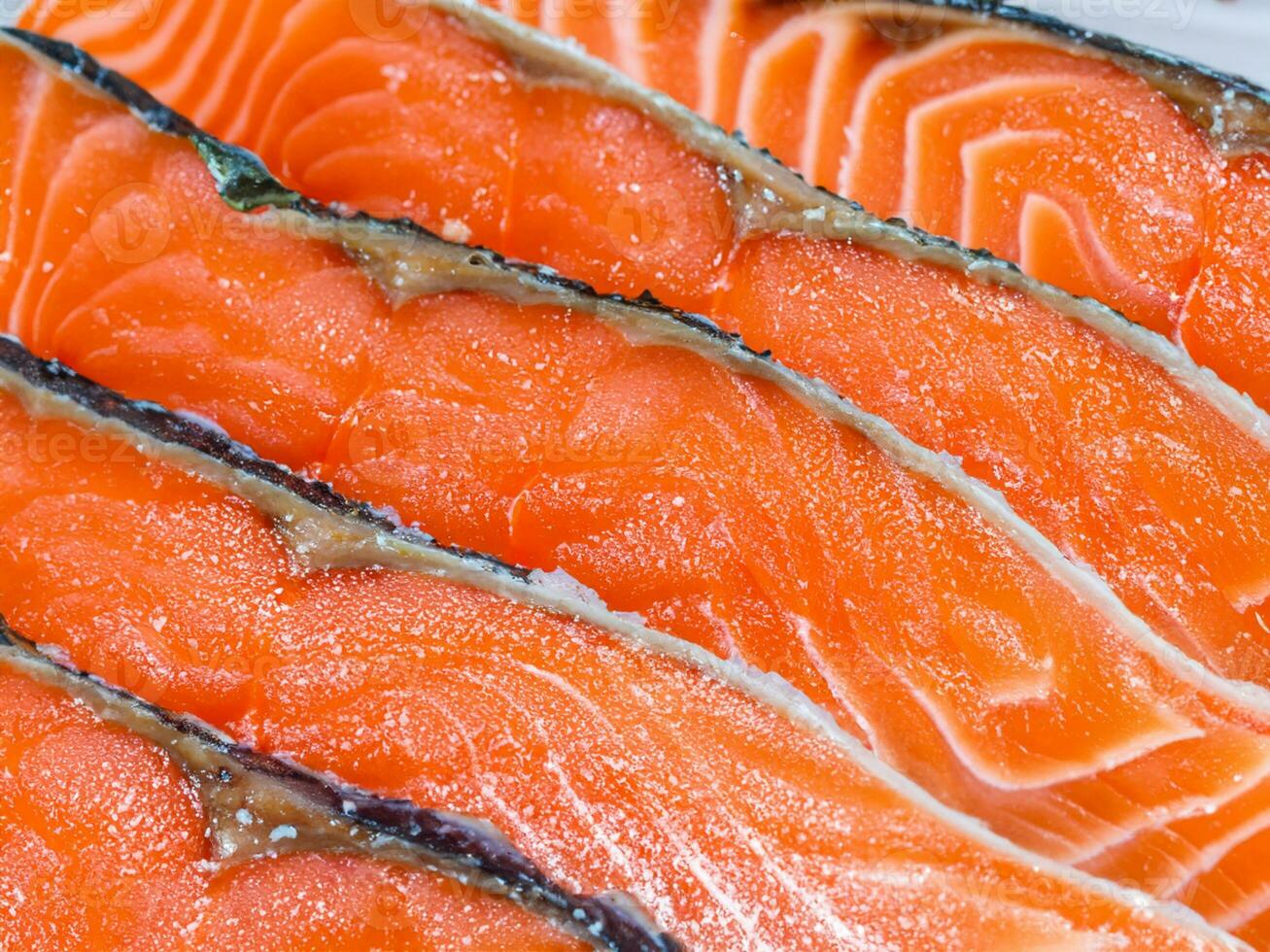 fresh salmon fillet on ice photo
