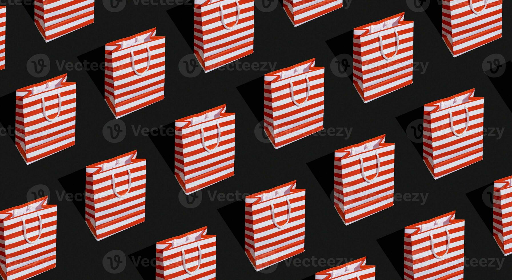 Pattern made from paper shopping bag. Black friday sale, shopping concept photo