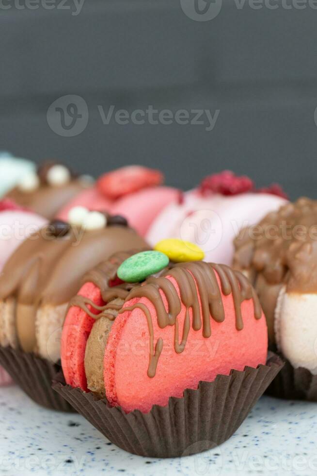 Colored macaroons with decoration for those with a sweet tooth close up. photo