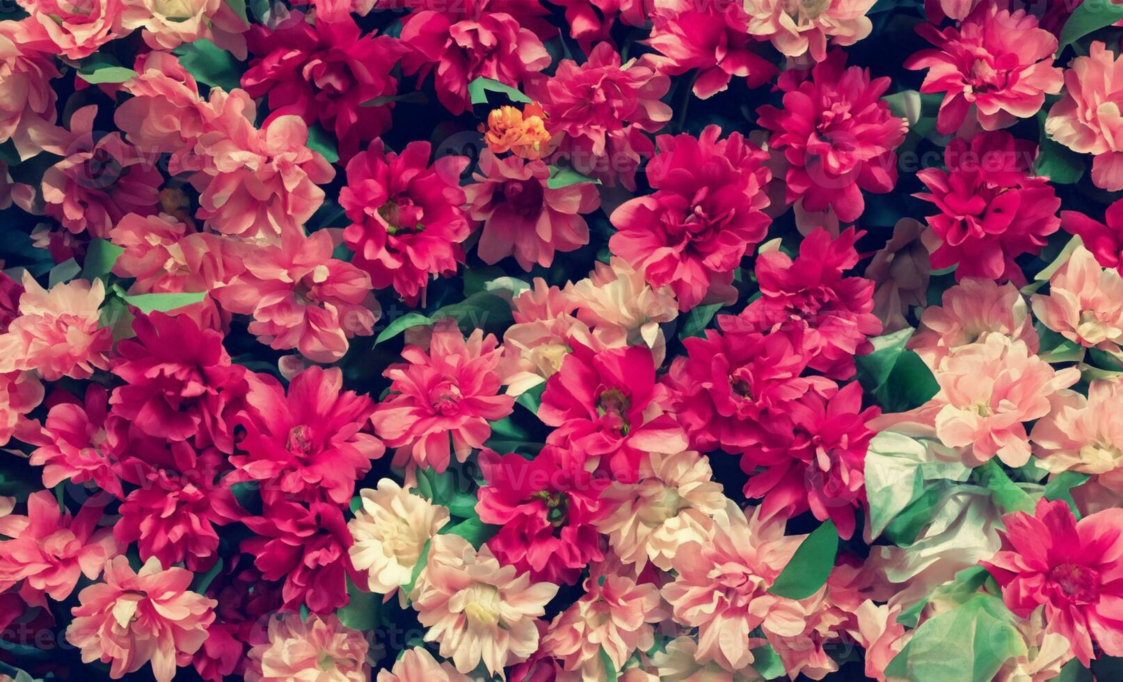 Artificial Flowers Wall for Background in vintage style photo