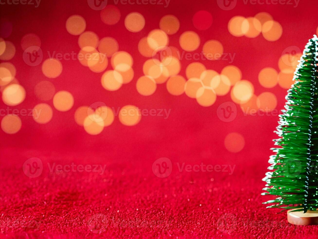 Christmas background with xmas tree and sparkle bokeh lights on red canvas background photo