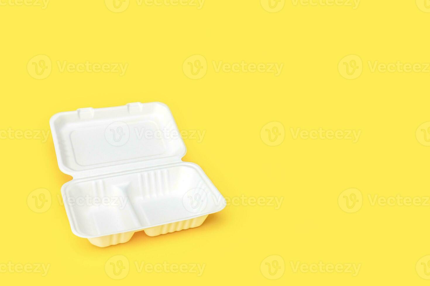 empty open container for food, lunchbox, recycled on yellow background with copy space photo