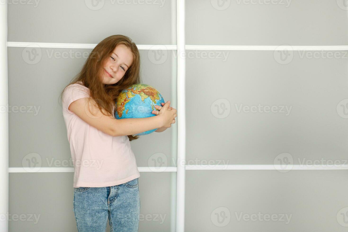 pretty girl tenderly hugs the globe photo