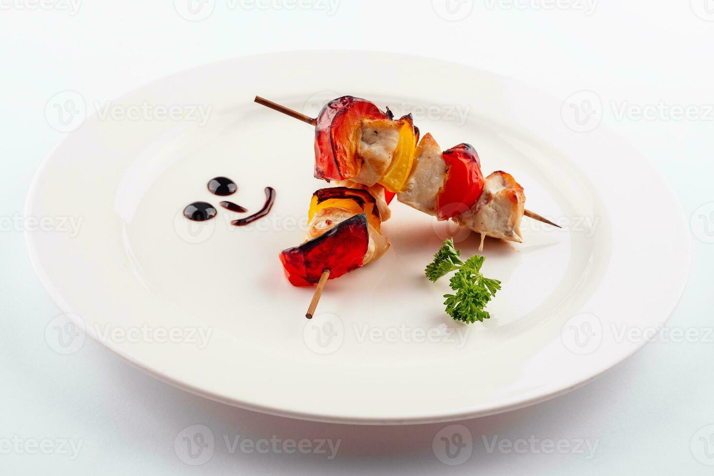 Chicken kebab on plate, close up view photo