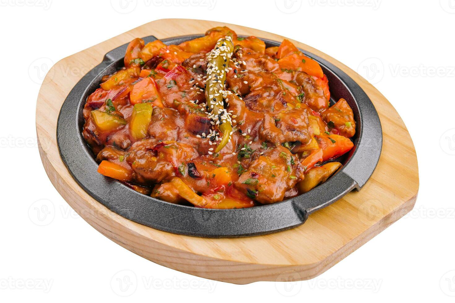 pan with vegetable stew on wooden board photo