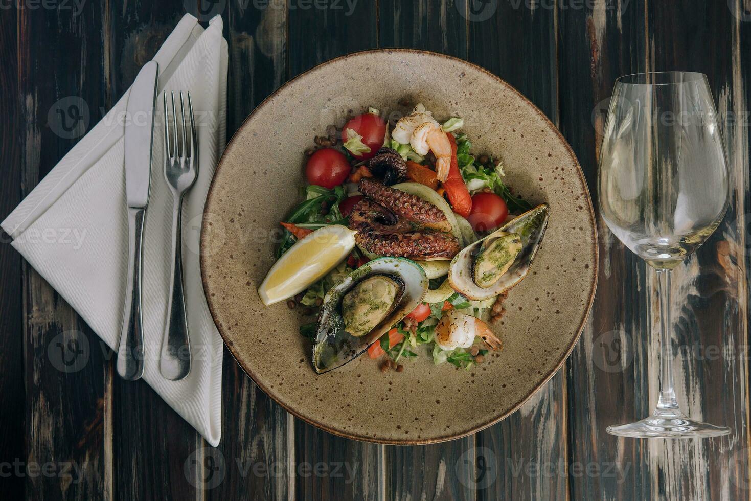 Seafood salad. Traditional spanish dish on wood photo