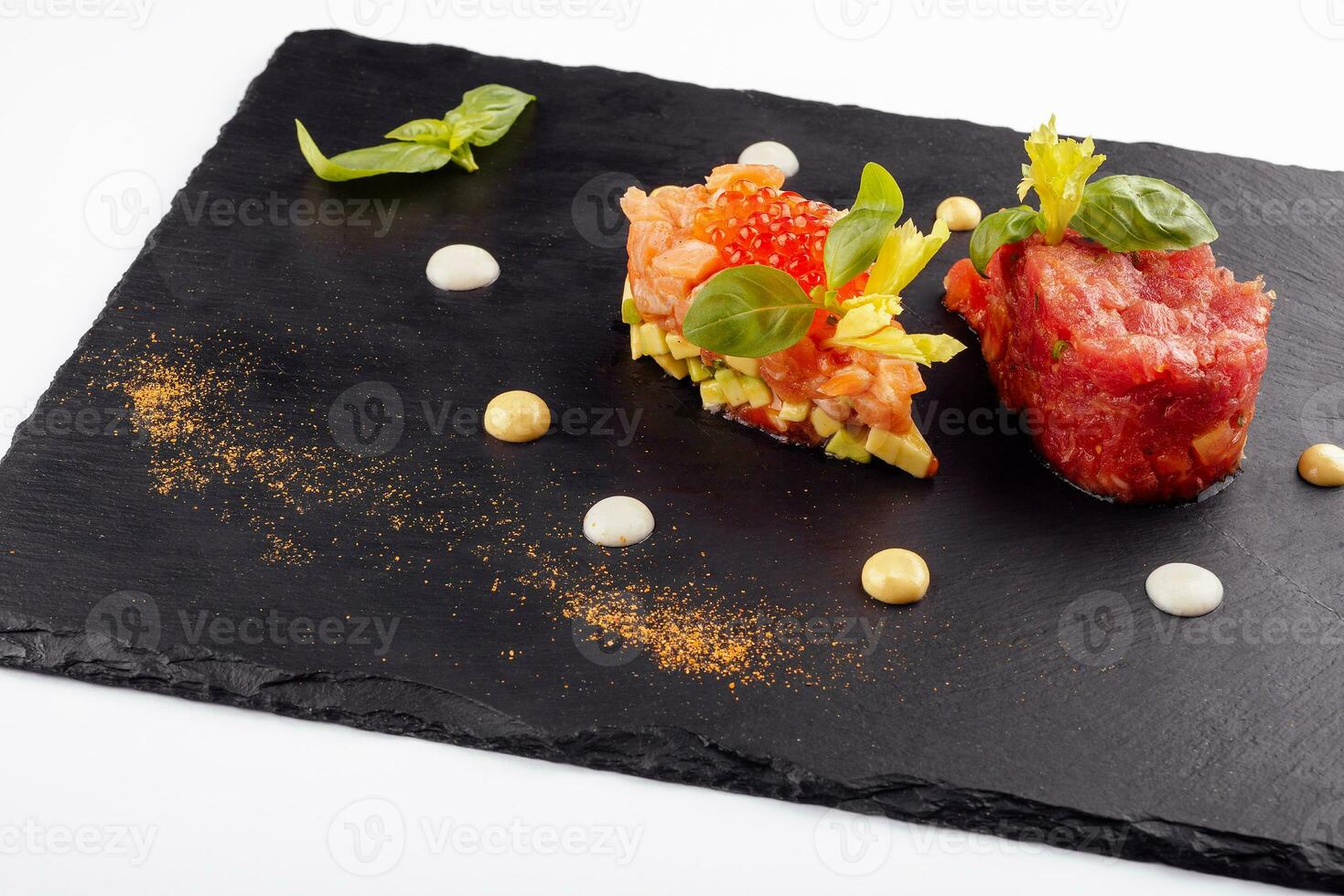 salmon and beef tartare on black board photo