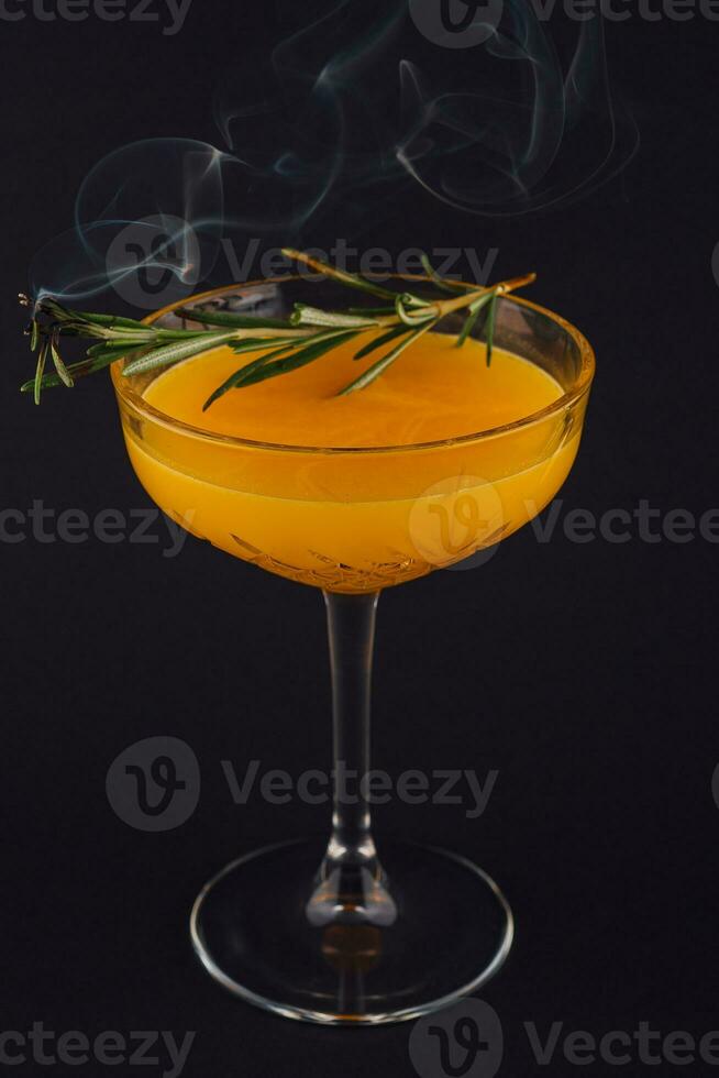 Rosemary cocktail - golden rum, rosemary, fruits juice and syrup photo